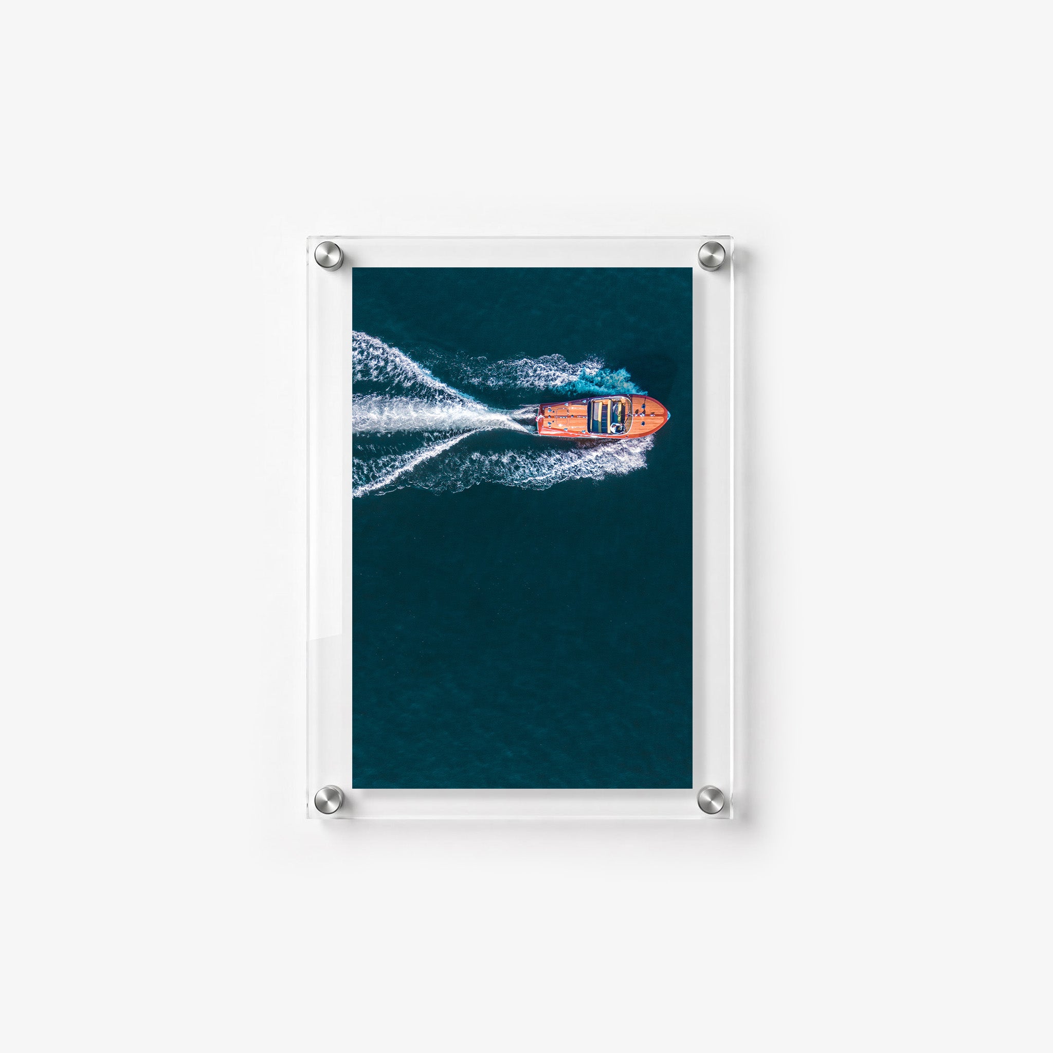 Acrylic wall art featuring an overhead view of a boat moving at high speed