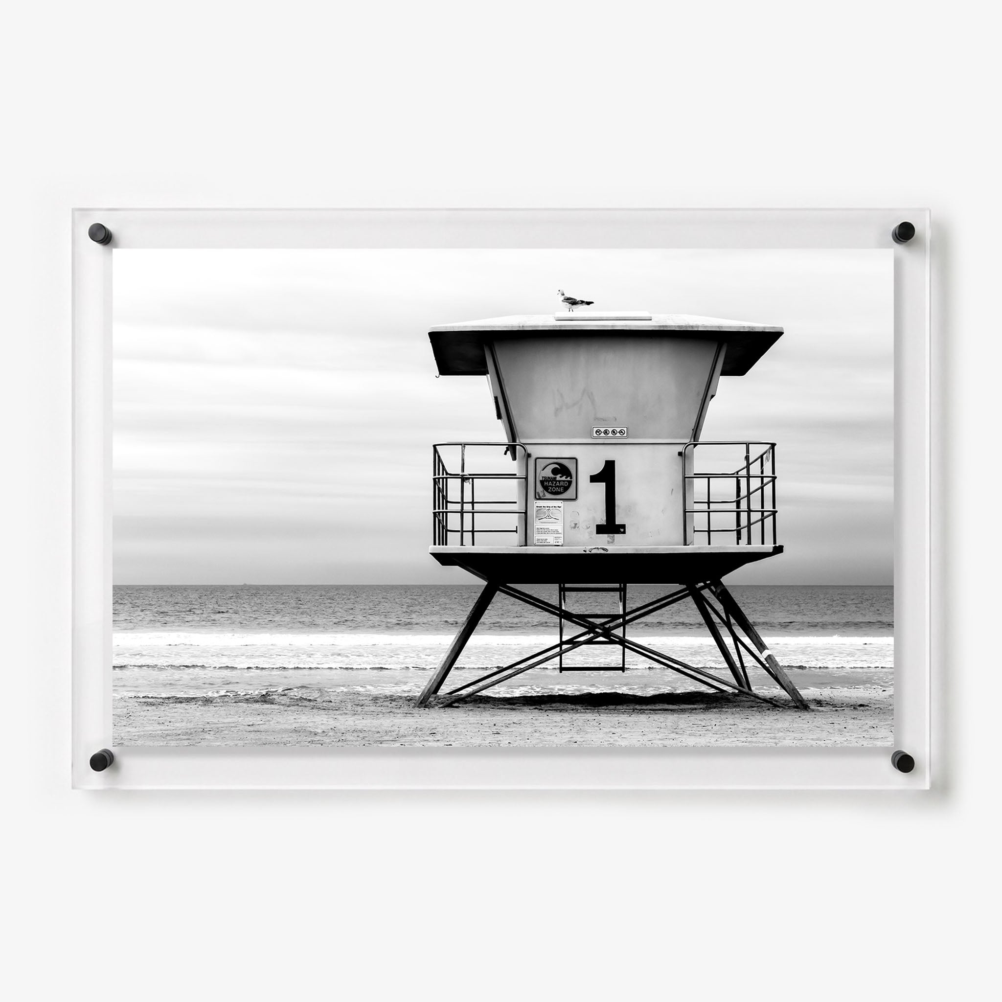 Acrylic wall art featuring a black and white lifeguard tower marked number 1
