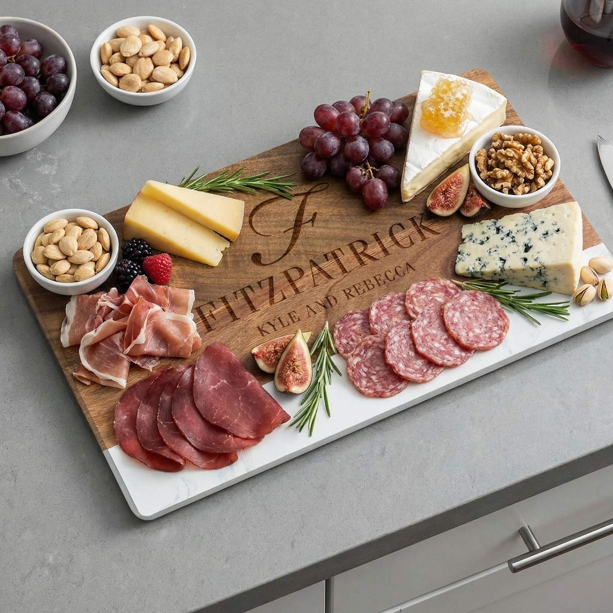 Personalized wooden charcuterie board with meats, cheeses, and fruits